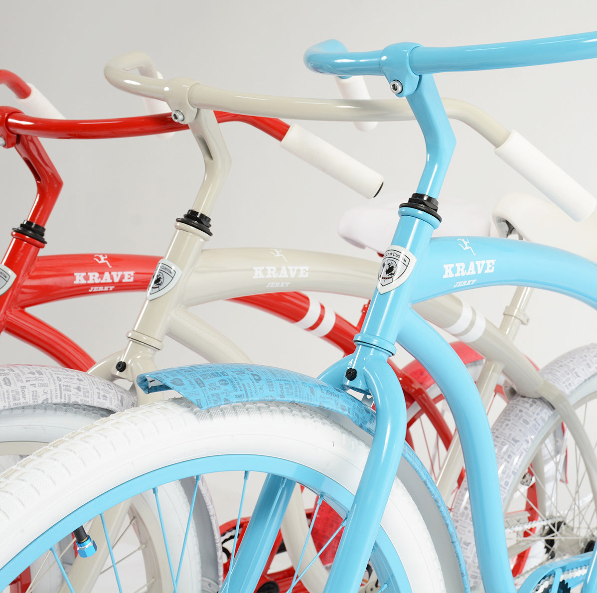 A finished fleet of red, creme, and light blue Villy Krave bikes for Signature Branding